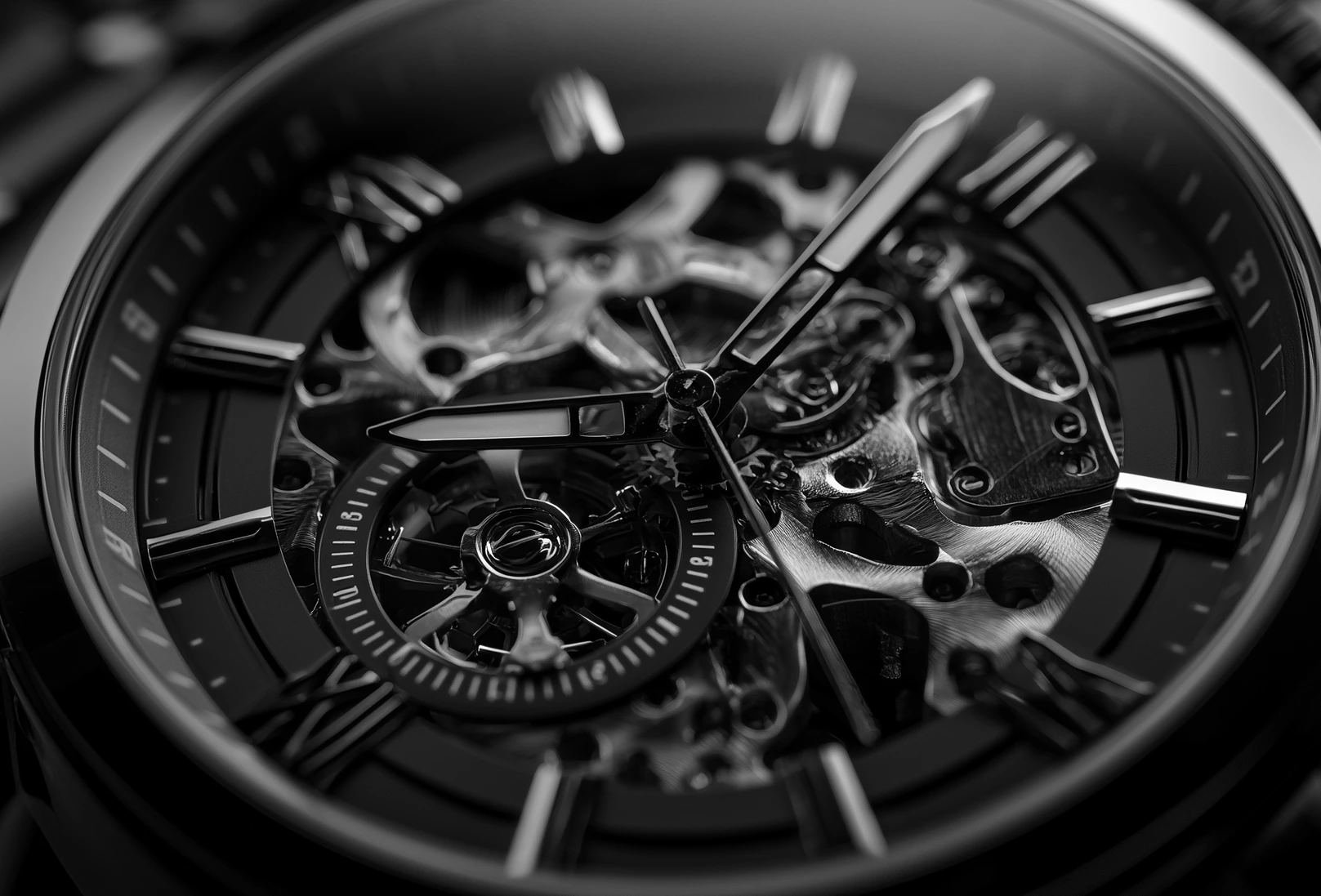 Close-up of a black skeleton watch and its intricate mechanism